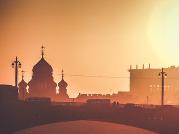 Silhouette of church against sky during sunset