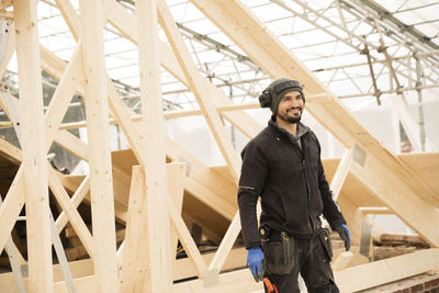 Happy male construction worker at construction site