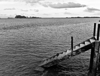 Pier on sea against sky