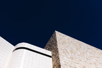 Low angle view of building against clear blue sky