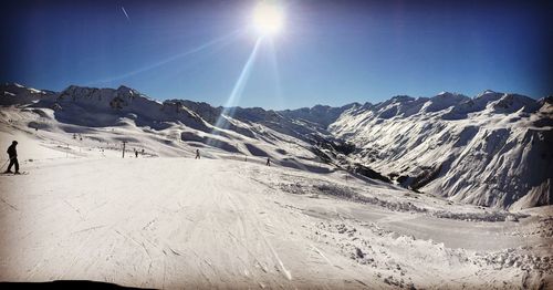 Scenic view of snowcapped mountains against sky