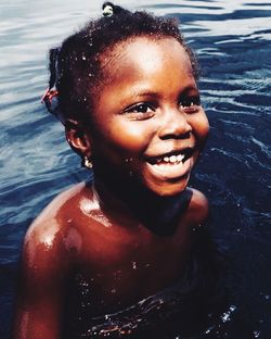 Portrait of smiling boy in water