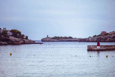 View of porto cristo harbour and lighthouse with copy space 
