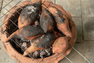 High angle view of meat on barbecue grill