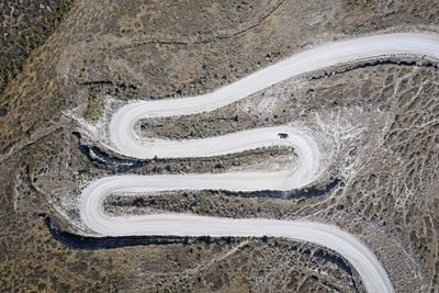High angle view of winding road on land