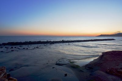 Scenic view of beach during sunset