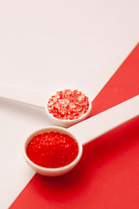 High angle view of strawberries on table against white background