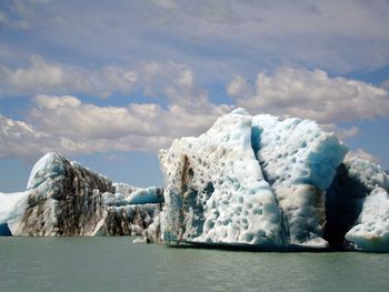 Scenic view of glaciers floating on sea