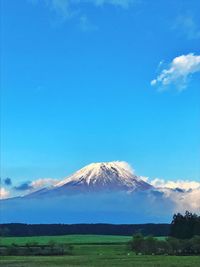 Scenic view of landscape against cloudy sky
