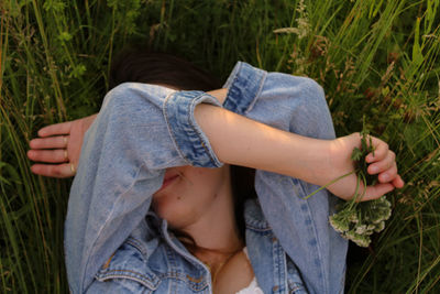 Low section of woman holding plants