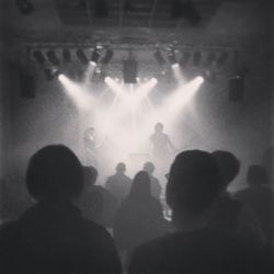 People enjoying concert at night