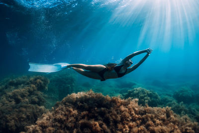 Woman swimming in sea