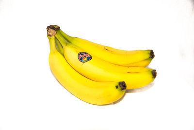 Close-up of yellow fruit against white background