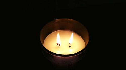 Close-up of lit tea light candle