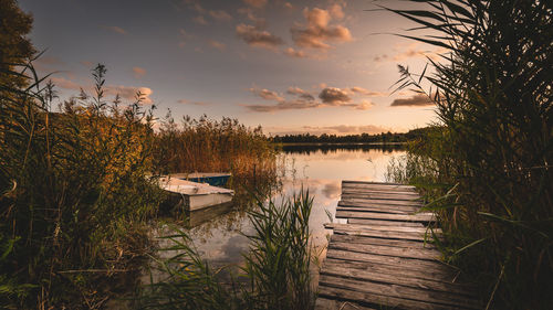 Scenic view of lake against sky during sunset