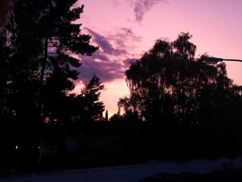 Silhouette trees against sky during sunset