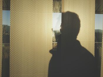 Woman looking through window