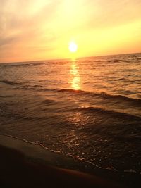 View of calm beach at sunset