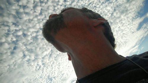 Low angle view of person against sky