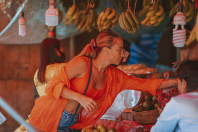 Portrait of a young girl near a fruit stand