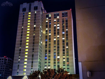 Low angle view of modern buildings at night