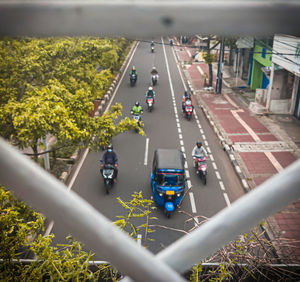 High angle view of vehicles on road in city