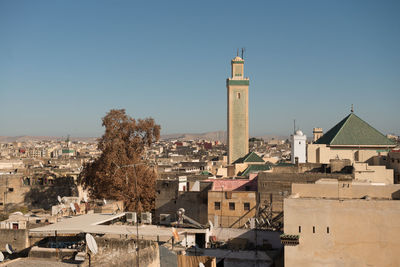 Buildings in city against sky