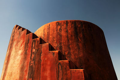 Low angle view of steps against clear sky at jaigarh fort on sunny day