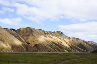 Scenic view of landscape and mountains against sky