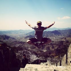 Full length of woman jumping in mid-air