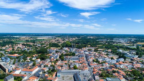 High angle view of cityscape against cloudy sky