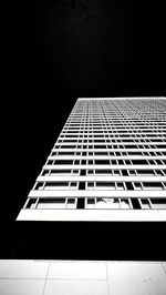 Low angle view of modern building against sky at night