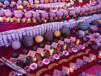 High angle view of candles for sale at market stall