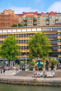 Cityscape view with resting people, at the quay in gothenburg, sweden