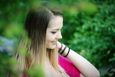 Smiling young woman looking away
