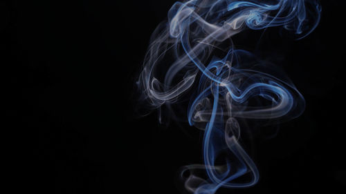 Close-up of smoke against black background