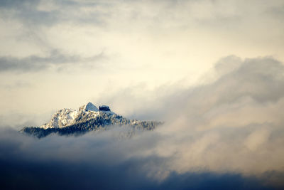 Low angle view of snowcapped mountains against sky during sunset