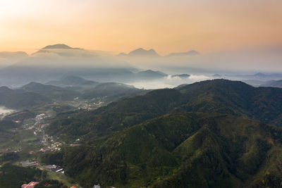 High angle view of mountains against sky during sunset