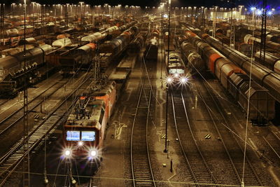 High angle view of train at railroad station at night