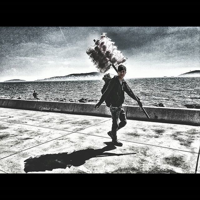 WOMAN STANDING ON SHORE