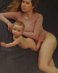 Midsection of mother and daughter