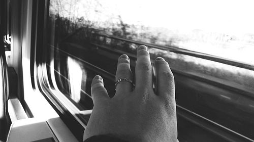 Close-up of woman hand in train