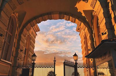 Low angle view of historic building against sky during sunset