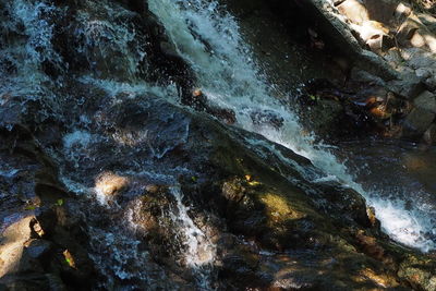 Close-up of water flowing through rocks
