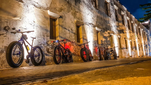 Bicycles against built structure