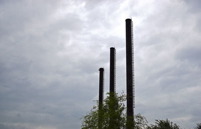 Low angle view of factory against sky