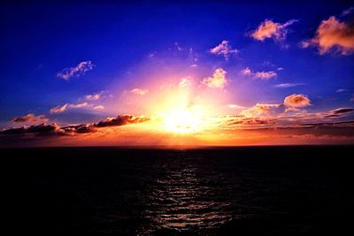 Scenic view of sea against romantic sky at sunset