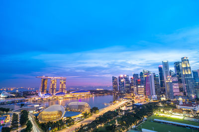 High angle view of cityscape against blue sky