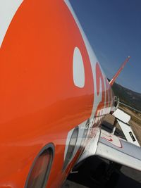 Close-up of airplane against sky