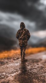 Rear view of man walking outdoors